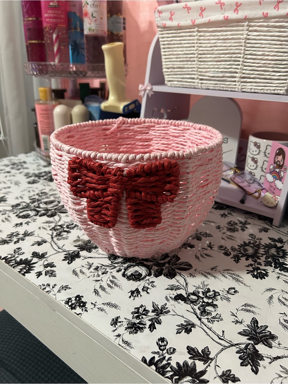 Pink Woven Decorative Basket with Red Bow Accent